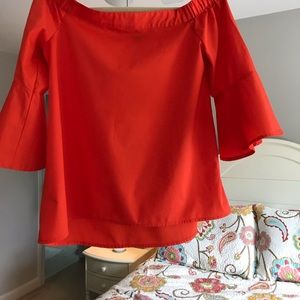 Bright orange off-the-shoulder top